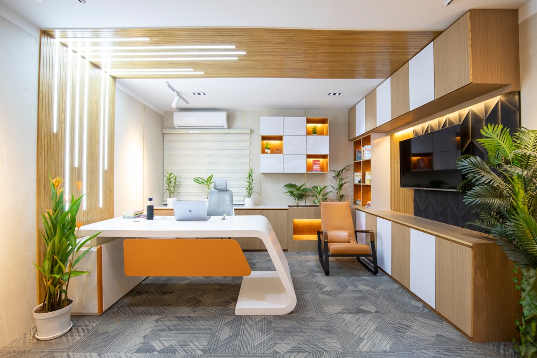 a-room-with-a-desk-and-a-chair-srtpwpbk0dg